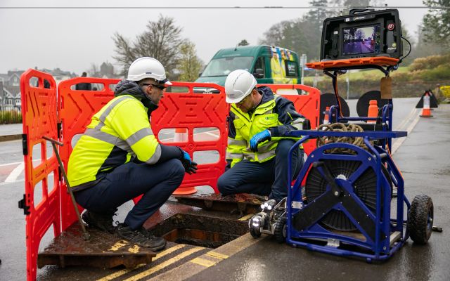 Engineers working on a smart sewer