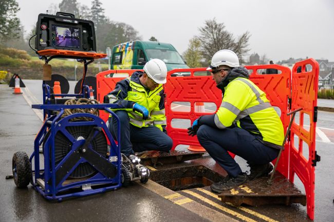 Engineers working on a smart sewer